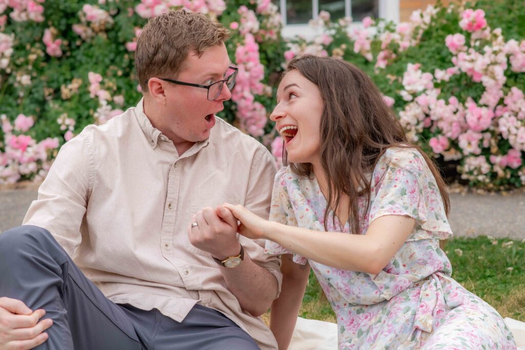 Couple looking at engagement ring in Camas WA