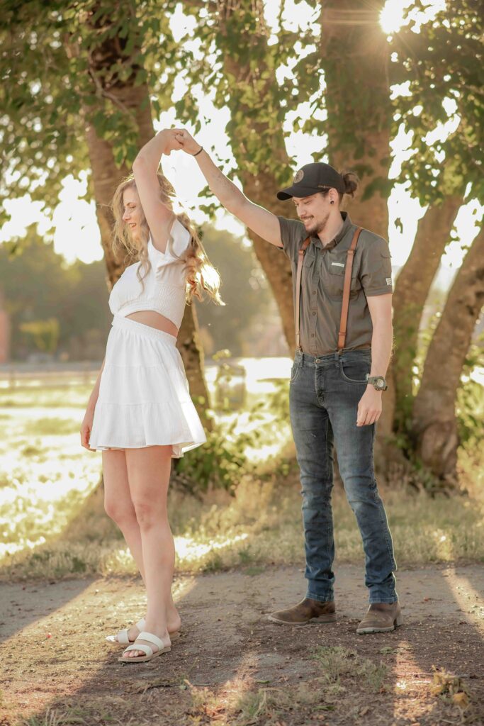 Engagement Photo session at Fort Vancouver, WA dancing on the pathway