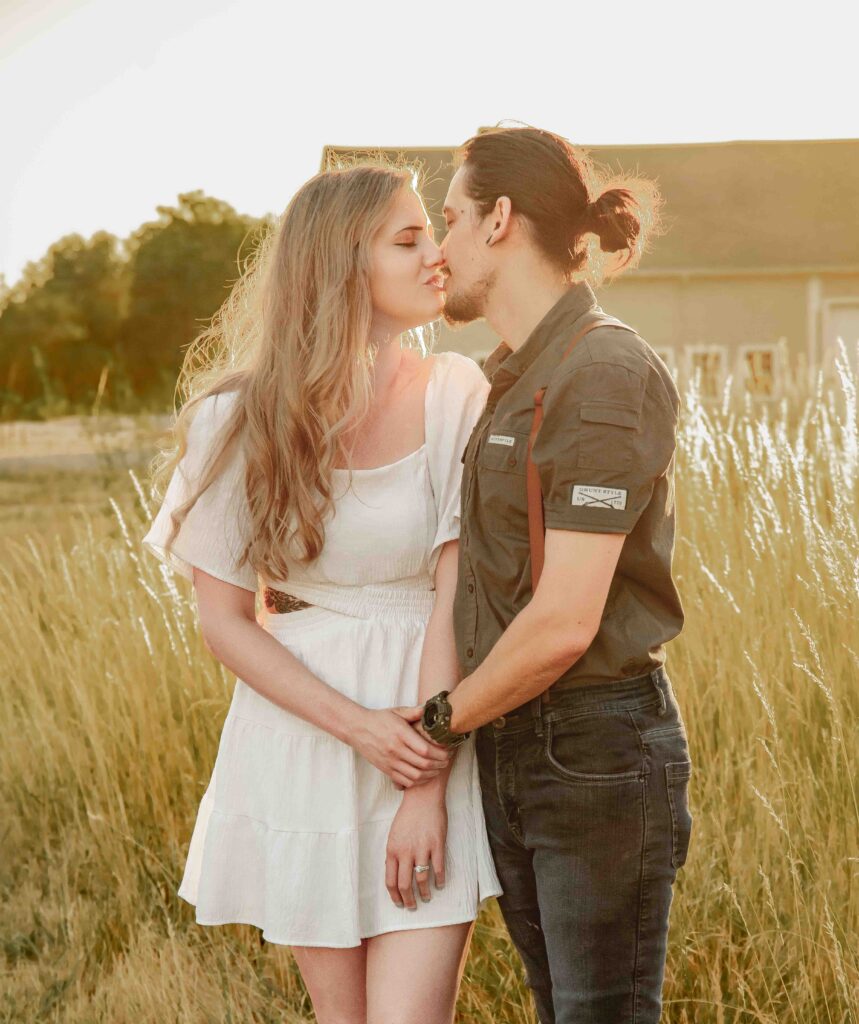 A couple standing in a field at golden hour at Fort Vancouver in Vancouver, WA